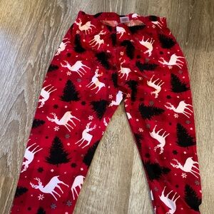 Christmas leggings with reindeer, snowflakes and trees.